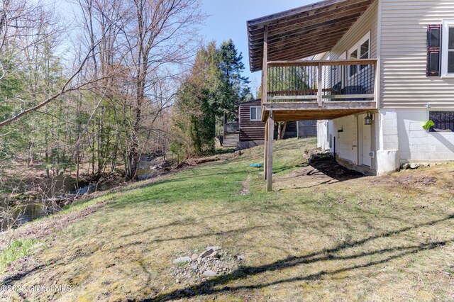 view of yard featuring a wooden deck