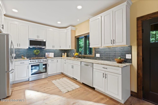 1181 Hunt Lake Rd Unit N, Corinth, NY 12822 - kitchen featuring white cabinetry and appliances with stainless steel finishes