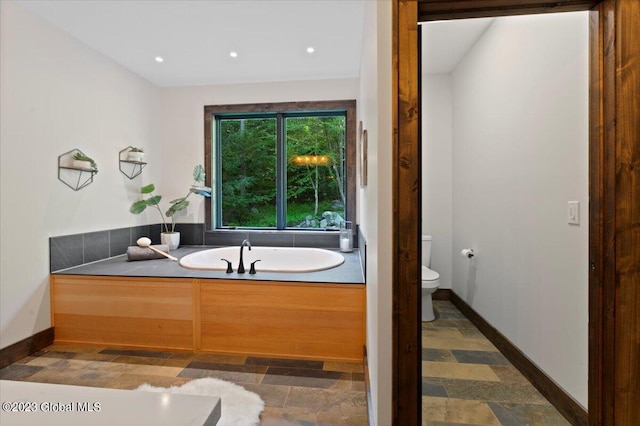 1181 Hunt Lake Rd Unit N, Corinth, NY 12822 - bathroom with recessed lighting, a garden tub, toilet, and baseboards