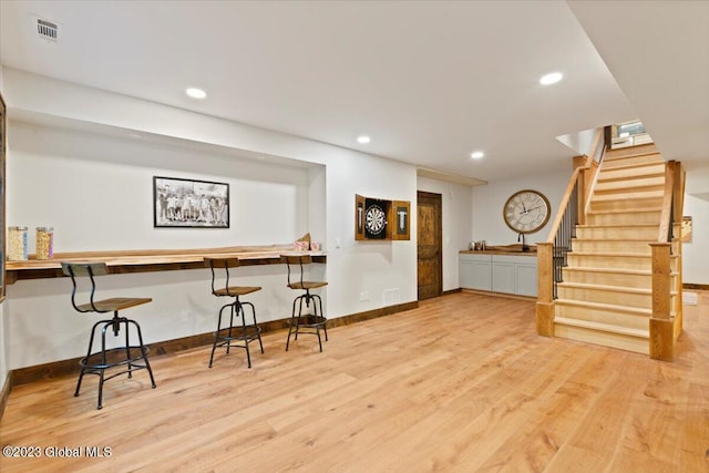 1181 Hunt Lake Rd Unit N, Corinth, NY 12822 - bar with wood finished floors, visible vents, recessed lighting, and stairs