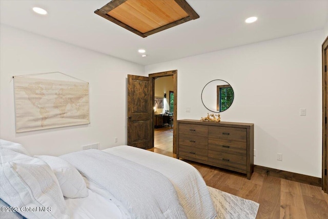 1181 Hunt Lake Rd Unit N, Corinth, NY 12822 - bedroom with recessed lighting, wood finished floors, visible vents, and baseboards