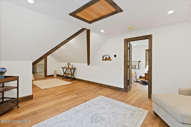 1181 Hunt Lake Rd Unit N, Corinth, NY 12822 - additional living space with light wood finished floors, vaulted ceiling, baseboards, and recessed lighting