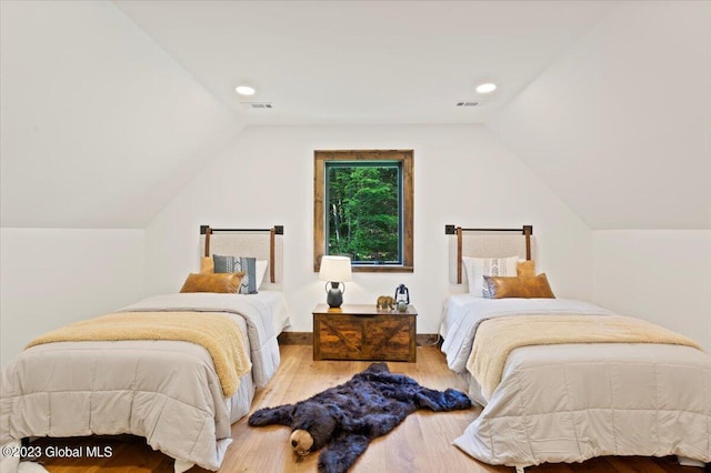 1181 Hunt Lake Rd Unit N, Corinth, NY 12822 - bedroom featuring recessed lighting, lofted ceiling, visible vents, and wood finished floors