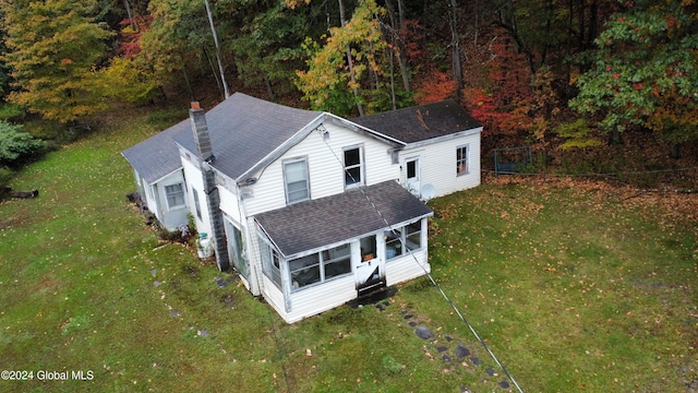 drone / aerial view featuring a forest view