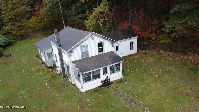 drone / aerial view featuring a view of trees