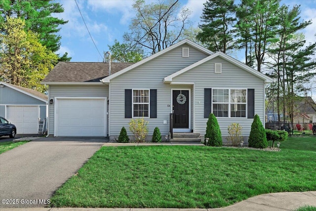 view of front facade featuring a garage, aphalt driveway, a shingled roof, a front lawn, and entry steps
