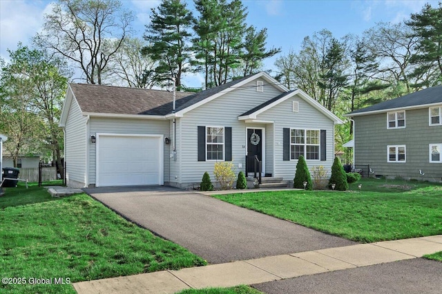 view of front of house featuring roof with shingles, an attached garage, driveway, and a front lawn