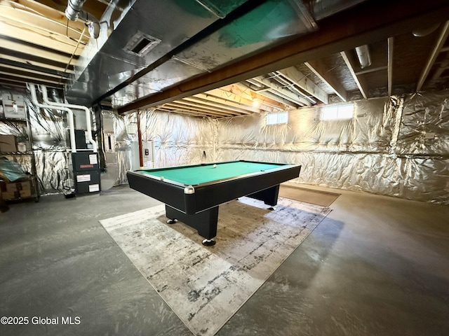 playroom with concrete flooring, pool table, and water heater