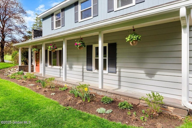 view of property exterior with covered porch