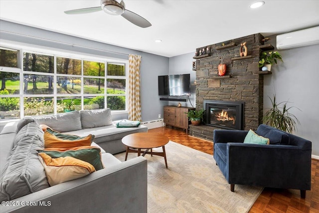 living room with an AC wall unit, a fireplace, ceiling fan, a baseboard radiator, and recessed lighting