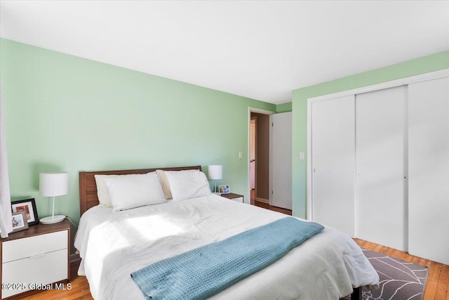 bedroom featuring a closet and wood finished floors