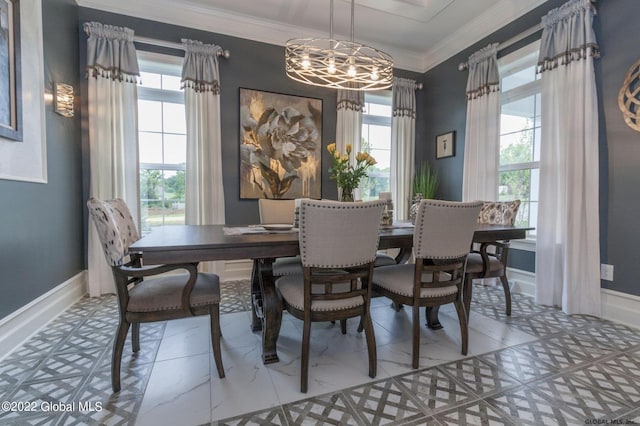 dining area with baseboards, a notable chandelier, and ornamental molding