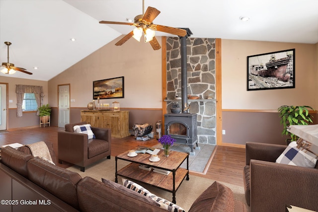 2694 State Route 10, Summit, NY 12175 - living room with ceiling fan, wood finished floors, a wood stove, high vaulted ceiling, and baseboards