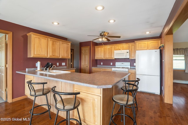 2694 State Route 10, Summit, NY 12175 - kitchen with white appliances, a sink, a peninsula, a ceiling fan, and dark wood-type flooring