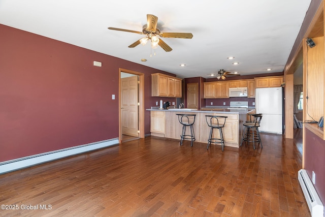 2694 State Route 10, Summit, NY 12175 - kitchen with white appliances, baseboard heating, a peninsula, a ceiling fan, and recessed lighting