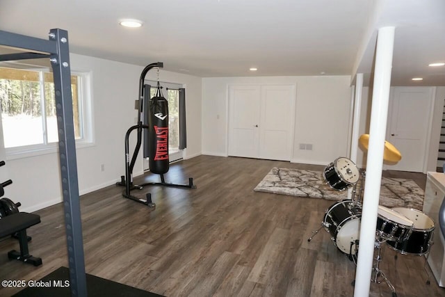 exercise area with baseboards, recessed lighting, and dark wood-style flooring