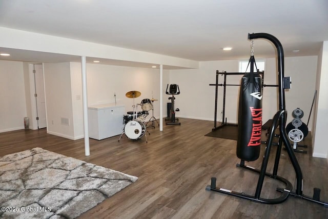 workout room with baseboards, wood finished floors, and recessed lighting