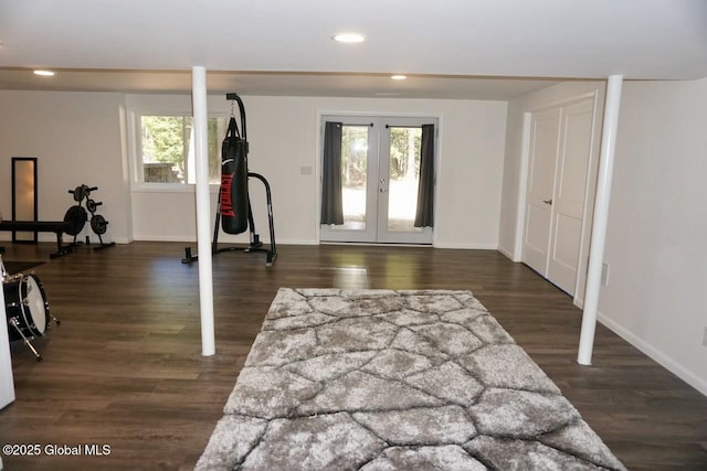 workout room with a wealth of natural light, french doors, wood finished floors, and recessed lighting