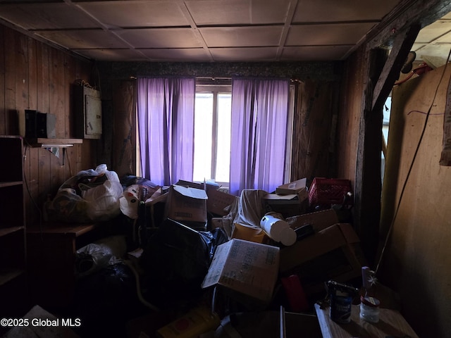 miscellaneous room with wood walls