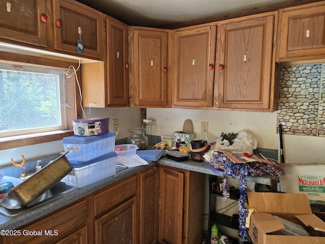 kitchen featuring brown cabinets