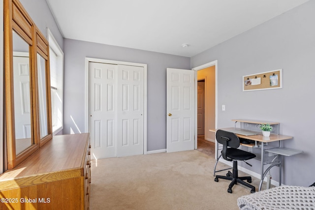 office with light colored carpet and baseboards