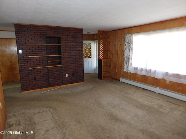 6 Riverview St, South Glens Falls, NY 12803 - carpeted empty room featuring a baseboard heating unit and wooden walls