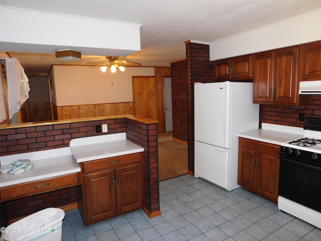 6 Riverview St, South Glens Falls, NY 12803 - kitchen featuring ventilation hood, range with gas cooktop, freestanding refrigerator, ceiling fan, and light countertops