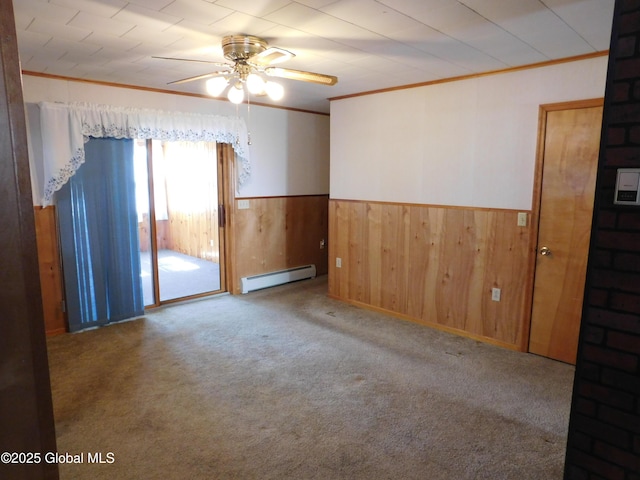 6 Riverview St, South Glens Falls, NY 12803 - unfurnished room featuring baseboard heating, wainscoting, ceiling fan, carpet floors, and ornamental molding
