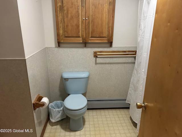 6 Riverview St, South Glens Falls, NY 12803 - bathroom with a baseboard radiator, toilet, a wainscoted wall, and tile patterned floors