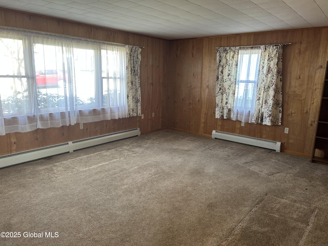 6 Riverview St, South Glens Falls, NY 12803 - carpeted empty room featuring baseboard heating and wooden walls