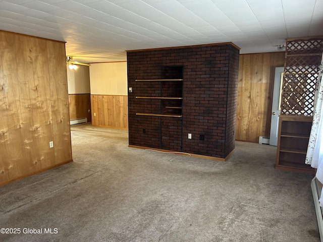 6 Riverview St, South Glens Falls, NY 12803 - unfurnished living room featuring a baseboard heating unit, a baseboard radiator, wooden walls, and carpet