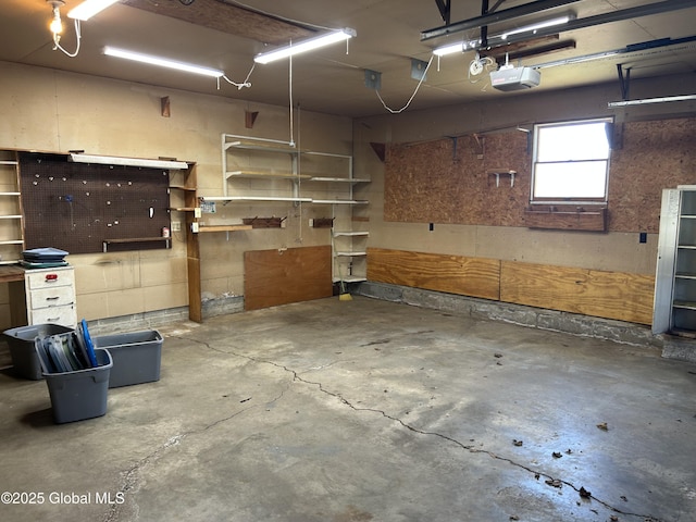 6 Riverview St, South Glens Falls, NY 12803 - garage featuring a workshop area and a garage door opener
