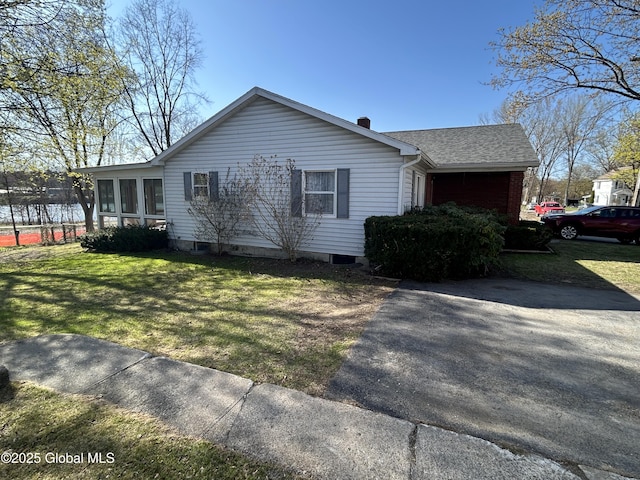 6 Riverview St, South Glens Falls, NY 12803 - view of side of home with a lawn, a sunroom, and roof with shingles