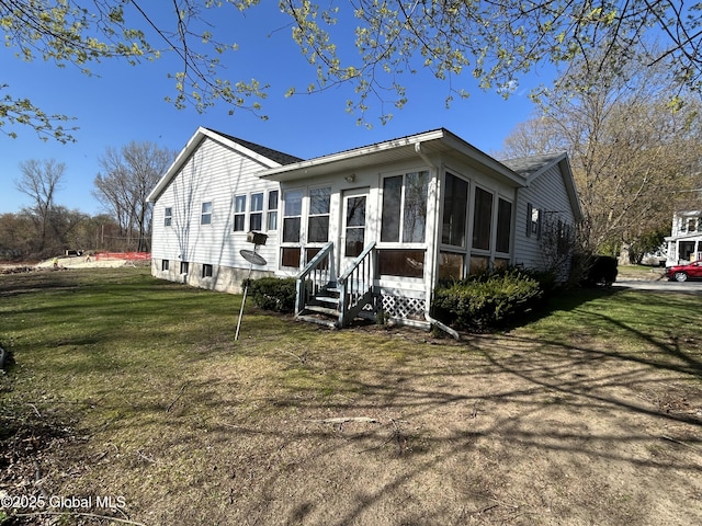 6 Riverview St, South Glens Falls, NY 12803 - back of house featuring a yard, entry steps, and a sunroom