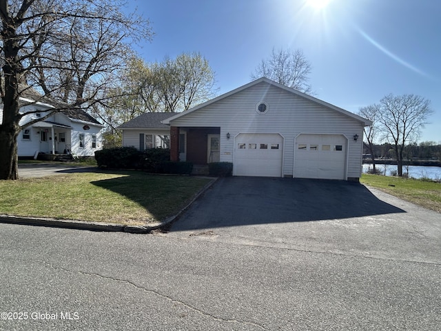 6 Riverview St, South Glens Falls, NY 12803 - ranch-style house with an attached garage, driveway, a front yard, and a water view
