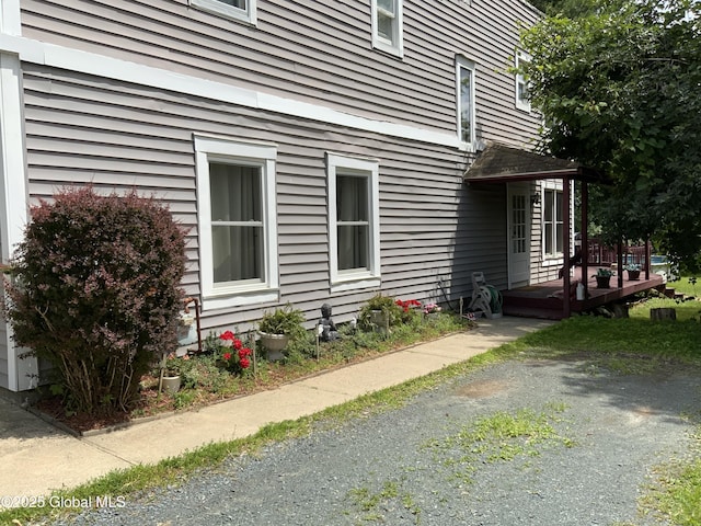 view of property exterior featuring a deck