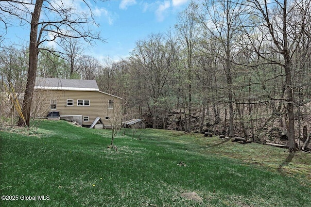 view of yard with a wooded view