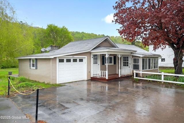 286 State Hwy Unit 80, Fort Plain, NY 13339 - view of front of home featuring a porch, a sunroom, and an attached garage
