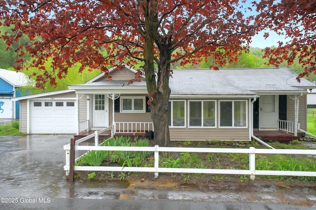 286 State Hwy Unit 80, Fort Plain, NY 13339 - ranch-style home with a fenced front yard, a garage, driveway, and a porch