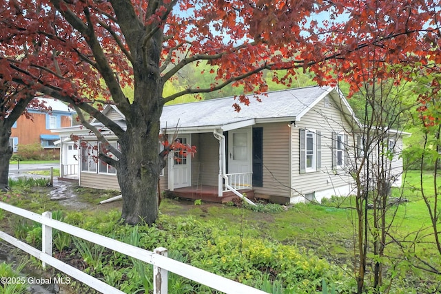 286 State Hwy Unit 80, Fort Plain, NY 13339 - ranch-style house with fence, covered porch, and roof with shingles