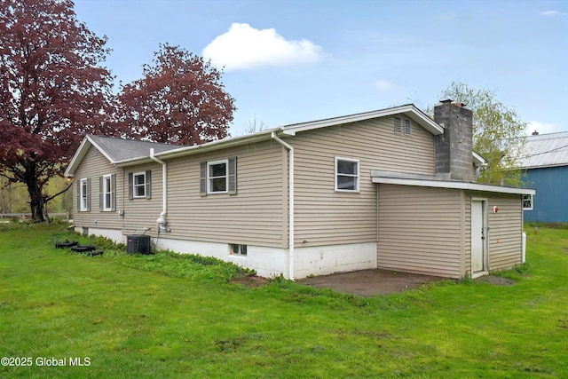 286 State Hwy Unit 80, Fort Plain, NY 13339 - rear view of property with a yard, a chimney, and cooling unit