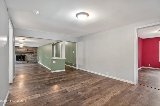 286 State Hwy Unit 80, Fort Plain, NY 13339 - unfurnished living room featuring a fireplace, wood finished floors, and baseboards