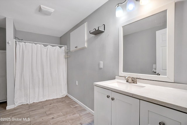286 State Hwy Unit 80, Fort Plain, NY 13339 - bathroom featuring vanity, a shower with shower curtain, wood finished floors, and baseboards
