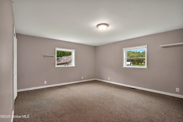 286 State Hwy Unit 80, Fort Plain, NY 13339 - unfurnished room with healthy amount of natural light, baseboards, and dark carpet