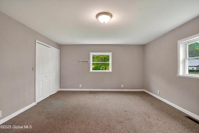 286 State Hwy Unit 80, Fort Plain, NY 13339 - unfurnished bedroom featuring carpet floors, baseboards, and a closet