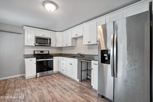 286 State Hwy Unit 80, Fort Plain, NY 13339 - kitchen with appliances with stainless steel finishes, a sink, tasteful backsplash, and light wood finished floors