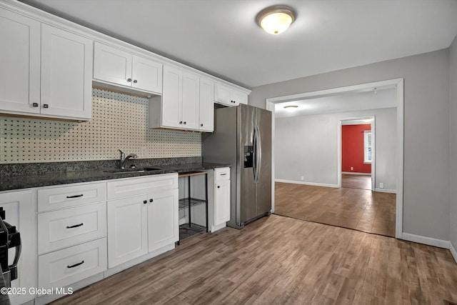 286 State Hwy Unit 80, Fort Plain, NY 13339 - kitchen with a sink, stainless steel fridge with ice dispenser, wood finished floors, backsplash, and white cabinets