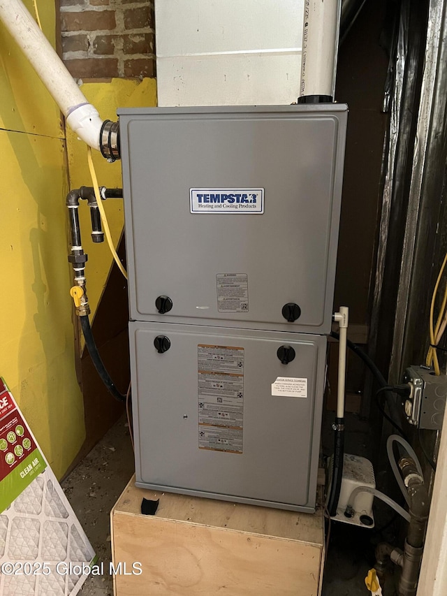 utility room with heating unit