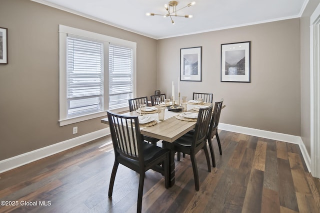 dining area featuring baseboards, ornamental molding, dark wood-type flooring, and a chandelier
