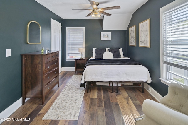 bedroom with baseboards and wood finished floors